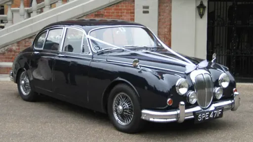Front side view os classic Daimler 250 V8 with white ribbons