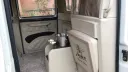 Taxi Cab seats in the rear cabing with cream leather and deep pile carpet