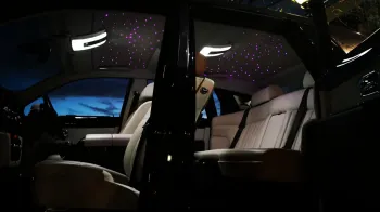 Rolls-Royce Phantom interior with both doors open and pink illuminated star light roof