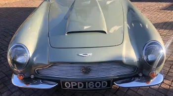 Front view of Aston Martin iconic front grill and badge on top