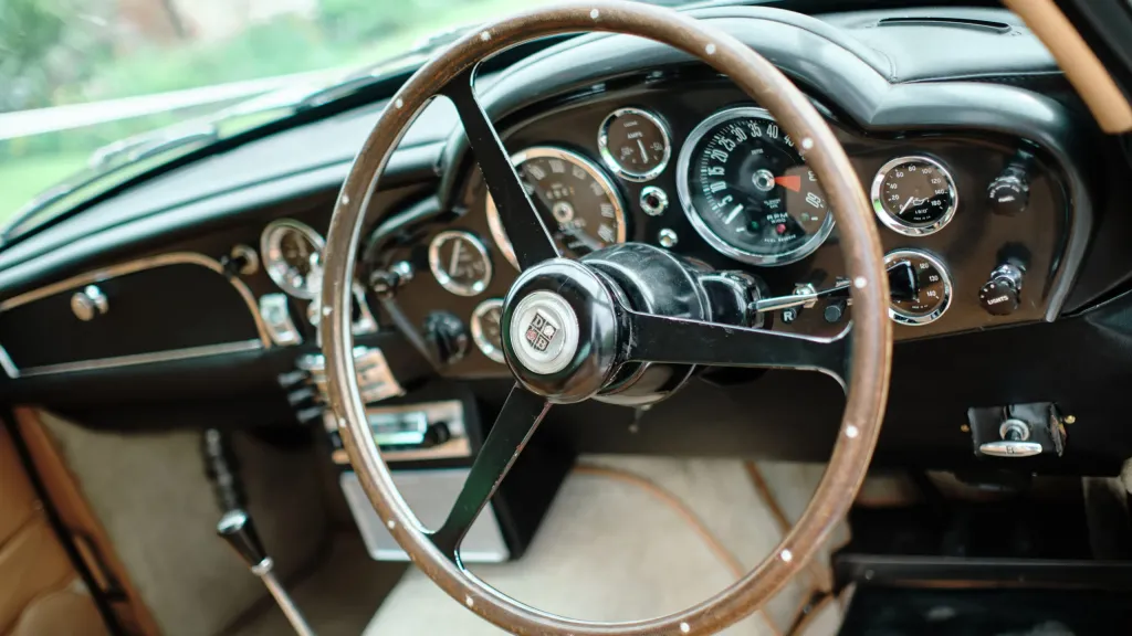 Steering wheel and dashboard inside Aston Martin DB6