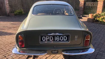 Rear view of Classic Aston Martin DB6 with shiny chrome bumper