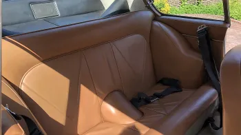 Rear interior seating in Aston Martin. Interior is Beige leather seat