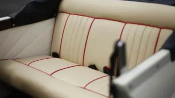 Cream leather rear seats with burgundy pipping.