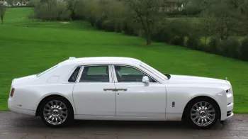 Rolls-Royce Phantom 8 full rioght side view with chrome alloy wheels and chrome handle doors
