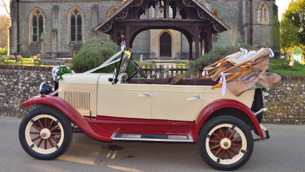 Left Side vieww of Vintage Chevrolet showing wide side and Burgundy wheel arches