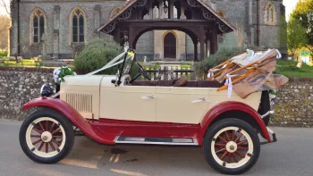 Left Side vieww of Vintage Chevrolet showing wide side and Burgundy wheel arches