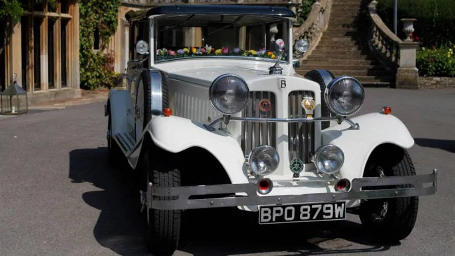 Full front view of Vintage Beauford showing chrome bumper and light.
