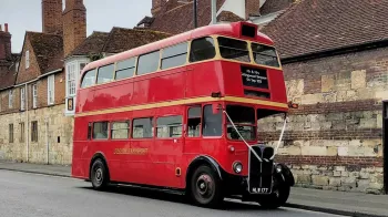 Double Decker Regent Bus decorated with white ribbons parked on rural streets near Buckingham