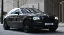 Rolls-Royce Ghost Series II in Black parked in front of a wedding venue
