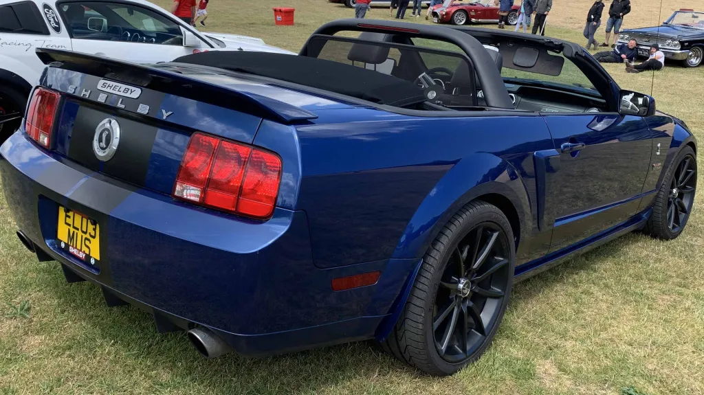 Rear view of Ford Mustang Convertible Shebly V8 with soft top roof open