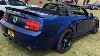 Rear view of Ford Mustang Convertible Shebly V8 with soft top roof open