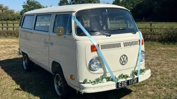 Volkswagen Bay Window Campervan in Ivory decorated with Light Blue Wedding Ribbons
