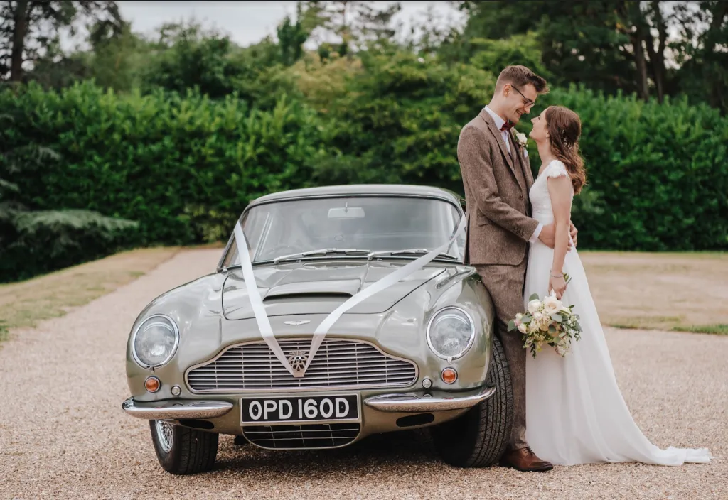 Having Adrian with us for our wedding made an already perfect day even more special with service that was outstanding in every way! The Aston Martin is absolutely beautiful, and Adrian was so kind and accommodating, putting us at ease and making us feel so special. We cannot recommend him enough and feel so grateful to have had him with us on our big day! Thank you so much Adrian, from Matt & Laura. (Photo: Emily Hudson)