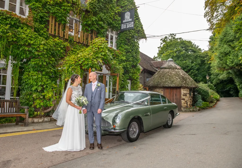 We found Adrian through Premier Carriages for our September 2022 wedding. Prior to making the booking we were able to meet Adrian and view his Aston Martin DB6… and straight after this we confirmed our booking as we were so impressed! Adrian was very friendly and professional. Very prompt to reply to messages too. On the day he turned up early and conversation on the drive was easy. The car was absolutely perfect and really added to the special day. Thank you so much for sharing your brilliant car on our wedding day! Loved every moment! Amanda and Adam Slater 