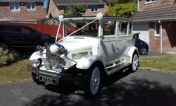 White imperial wedding car