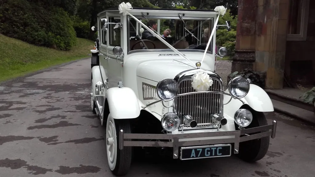 White imperial wedding car