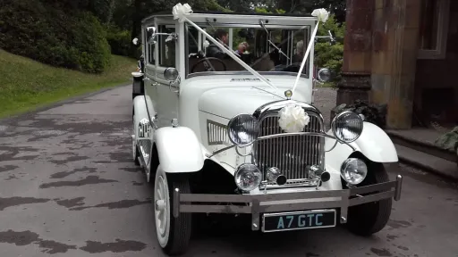 White imperial wedding car
