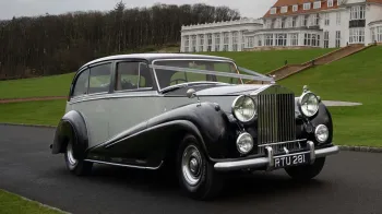Rolls-Royce silver Wraith LWB decorated with wedding ribbons