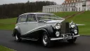 Rolls-Royce silver Wraith LWB decorated with wedding ribbons