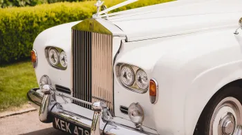Rolls-Royce Silver Cloud front view of twin headlight and its tall chrome radiator