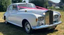 Rolls-Royce Silver Cloud II with twin headlight and dark pink ribbons