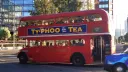 Routemaster bus traveklling in street of london with Wedding guests inside