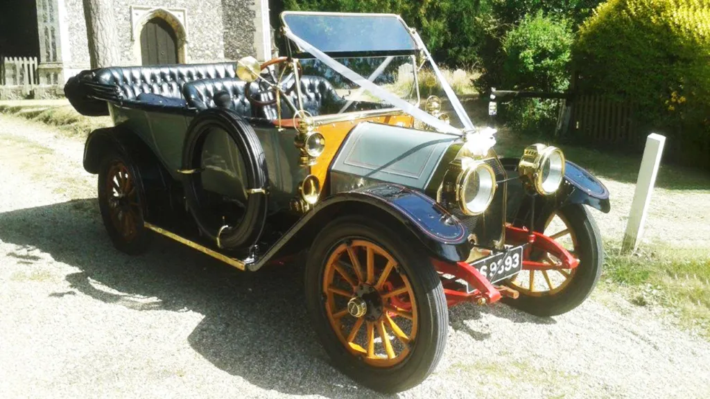 Vintage Oakland Model 40 Convertible decorated with White Ribbons in front of a church