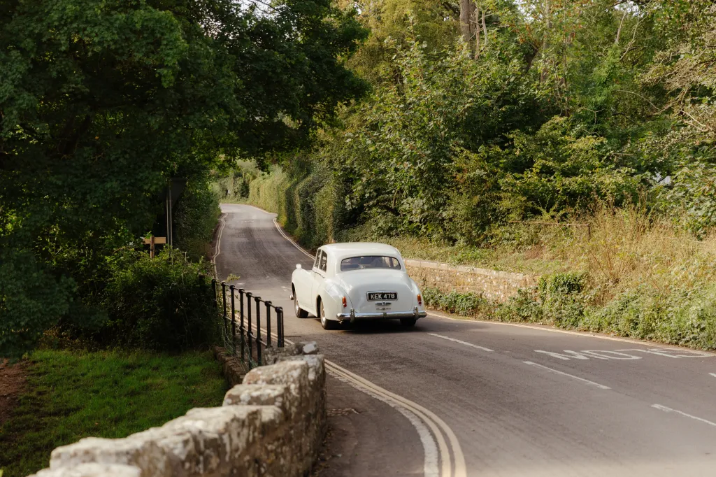 We had an incredible experience! The car was stunning, and our driver was an absolute 10/10 - arriving early, incredibly friendly, and making us feel completely at ease during the journey from the church to the wedding venue. The photos with the Rolls Royce are something we’ll cherish forever, and having this beautiful car for our special day meant so much to us. We couldn’t recommend it highly enough - just brilliant!Photo by: https://marisoulstudio.com/