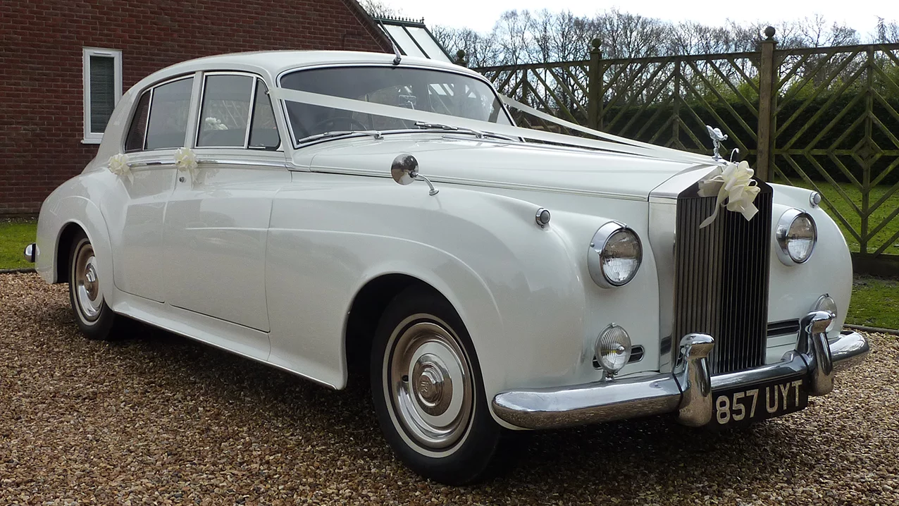 White Classic Rolls-Royce Silver Cloud with Silver Grey leather interior seats up to 4 passengers