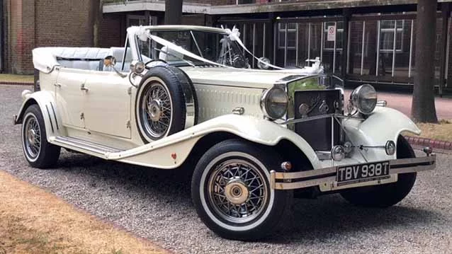 Ivory Vintage Style Beauford Convertible for hire with black roof and Cream Leather interior seats up to 3 passengers
